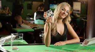 Live blackjack game with dealer and player cards visible